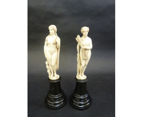 A PAIR OF EUROPEAN CARVED IVORY FIGURES, 18th/19th Century, allegorical of autumn and winter, modelled as classical nude maid