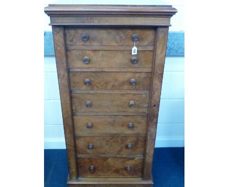 A LATE VICTORIAN WALNUT WELLINGTON CHEST, Bulstrode of Cambridge, the cornice top above seven graduated drawers between plain