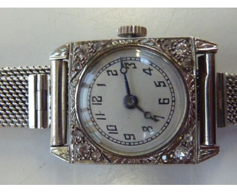 A LADIES DIAMOND WATCH, circa 1910, the circular dial within a square-shape with old-cut diamonds, fifteen jewelled movement,