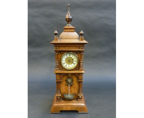 A LATE 19TH CENTURY GERMAN WALNUT WATERFALL MANTEL TIMEPIECE, the 8cm dial with cream enamel chapter ring having black Roman 