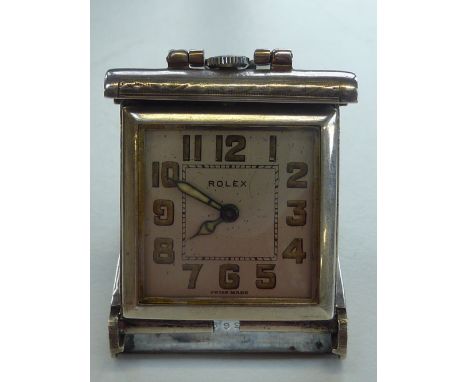 AN ART DECO STYLE SILVER ROLEX TANK WATCH, the square dial with Arabic numerals, with outer engine-turned sliding case stampe