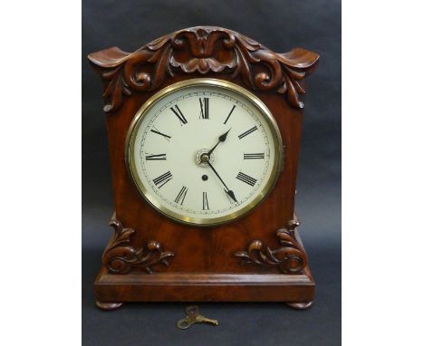 A 19TH CENTURY MAHOGANY MANTEL CLOCK, 7 3/4 inch, enamelled dial with Roman numerals and subsidiary alarm dial, on a brass re