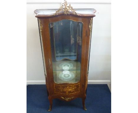 A LOUIS XV STYLE BRASS MOUNTED KINGWOOD AND MARQUETRY SERPENTINE VITRINE, the part glazed door enclosing two glass shelves wi