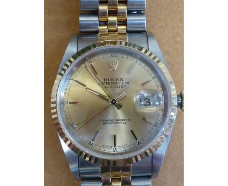 A GENTLEMANS BI-COLOUR ROLEX OYSTER PERPETUAL DATEJUST WRISTWATCH, stainless steel and gilt, the gold tone dial with baton ho