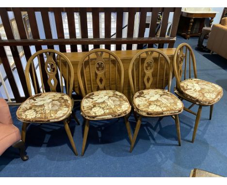 An Ercol gateleg table and four chairs