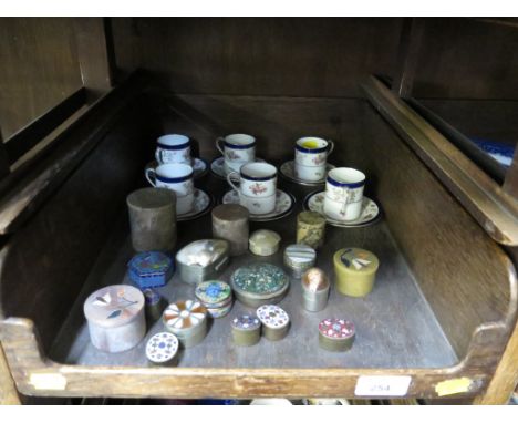 A set of six Coalport coffee cans and saucers, with rose decoration and eighteen various pill boxes, including stone, enamel 