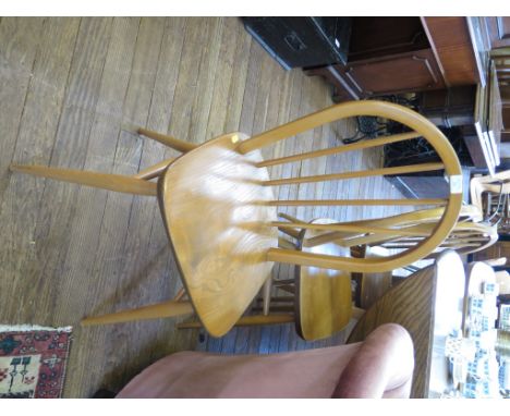 An Ercol elm top drop leaf table, on tapering square legs 113cm wide, and four Ercol hooped back chairs (5)