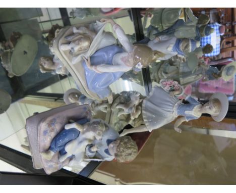 Lladro figures: Abrigando al Perro no. 5688, Invierno Infantil no. 5220 both in original boxes, Alegria en le Campo and boy w