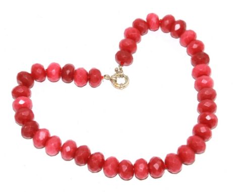 A string of faceted ruby beads