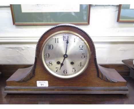 An oak 'Admiral Hat' mantel clock with silvered dial, a Victorian clock movement and dial in a later case and a barometer dia