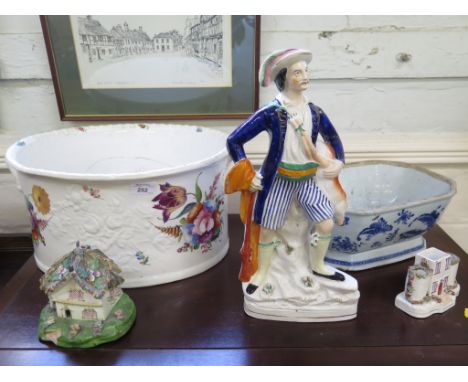 A Staffordshire figure of a Huntsman holding his catch 37cm high, a cottage pastille burner, a large Victorian basin, blue an