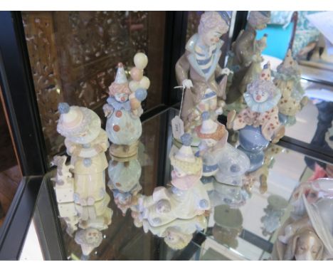 Lladro figures: Six clown figures including Nino Pierrot con Perrito (no. 5277) and Nino Pierrot con Perrito y Concertina (no