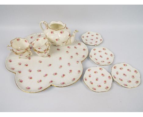 A quantity of Wileman &amp; Co tea wares, pattern 7447, comprising lobed tray, teapot (lacking cover), four cups and four sau