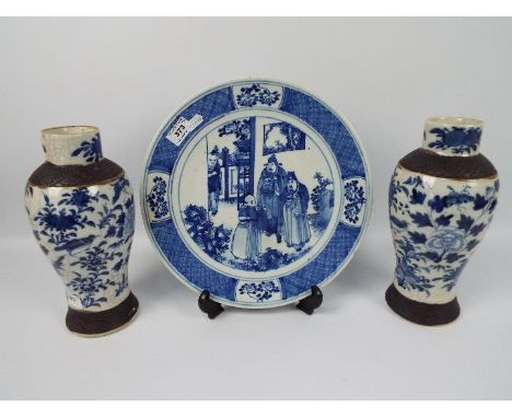 A pair of Nanking blue and white, crackle glaze vases with oxidised bands to the foot and shoulder, approximately 27 cm (h) a