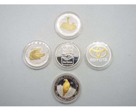 Five one troy ounce (ozt) .999 fine silver coins / medallions struck by Liberty Mint comprising Mobil, Toyota and United Stat