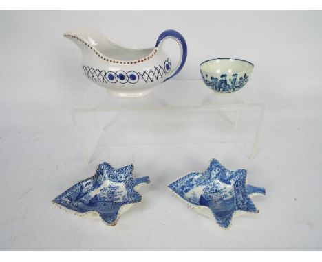 Lot to include two blue and white leaf form pickle dishes in the style of Bow (12 cm length), a sauce boat marked to the base