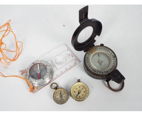 A World War Two (WW2 / WWII) black lacquered, brass MK III marching compass by T G Company, dated 1940, numbered B22571 and s