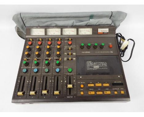 Tascam - Portastudio 244 - 4-track cassette recorder and 4-channel mixer in one portable unit, measuring 455 (W) x 120 (H) x 