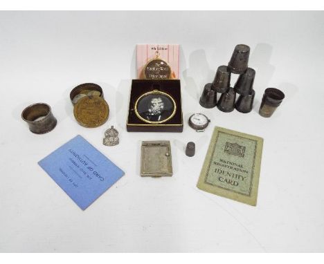 Mixed collectables to include a silver ARP badge and ephemera, silver napkin ring and thimble, white metal shot cups, small q