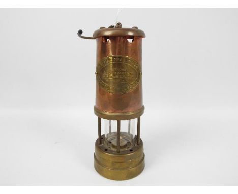 A brass safety lamp, British Coal Mining Company, Wales, Aberaman Colliery, serial number 16647.
