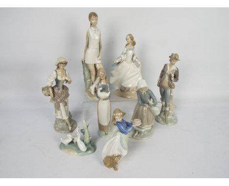 A collection of Lladro and Nao figures, largest approximately 32 cm (h)