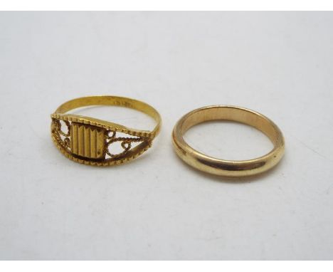 A 9ct gold wedding band, size K+½ (2.5 grams) and a yellow metal ring stamped 18c, size O (1.5 grams)