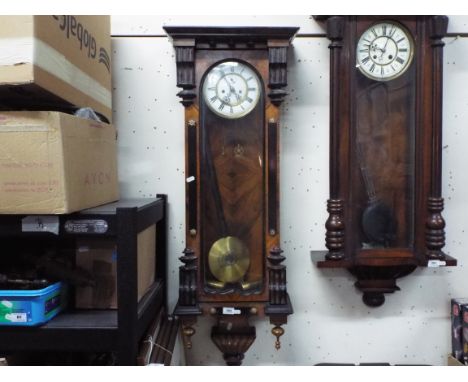 A dark wood Vienna style wall clock, two-piece enamel dial with Roman numerals and subsidiary seconds indication, matched blu