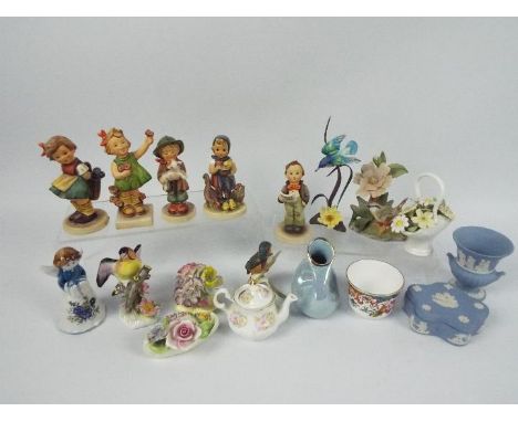 A collection of mixed ceramics to include Hummel figures, Wedgwood Jasperware, Spode and similar