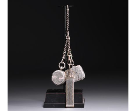 Silver and silver-plated metal chatelaine, a coin holder (broken), a pyrogen match holder, and a pencil holder, 20th century.