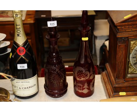 Two ruby flash glass decanters and stoppers