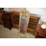 An ornate gilt framed wall mirror