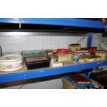 A collection of various advertising tins