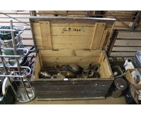 A wooden storage trunk and contents of various metal ware including mincers, metal tray, various drinking tankards and variou