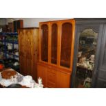 A modern display cabinet raised on cupboard base