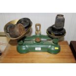 A set of kitchen scales and collection of weights