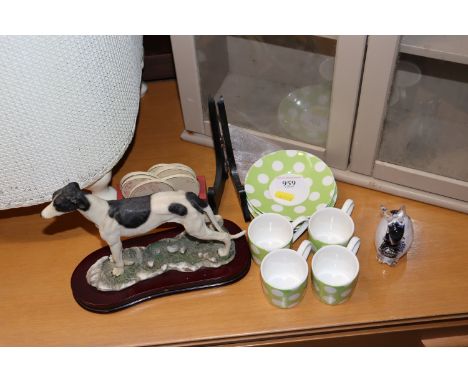 A collection of Bartlett & Sons coffee cans; glass paperweight in the form of a rabbit and a model dog