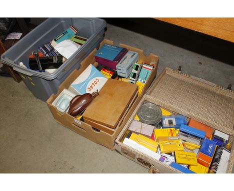 Three boxes containing a camera; various slides and accessories