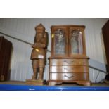 A jewellery display cabinet and a carved wooden fi