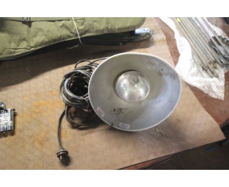 A metal hanging industrial style light fitting, sold as a collectors item