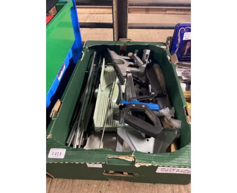 A box containing mitre saw and various attachments etc