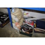 A bag of cushions and box containing bags, belts,