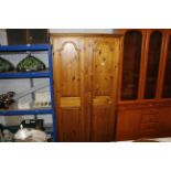 A Ducal pine two door wardrobe