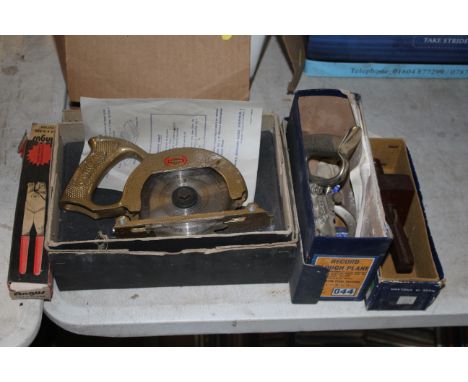 A Wodan drill attachment circular saw in original box with instruction manuals, a Record No. 044 moulding plane with original