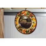 A circular framed wall mirror