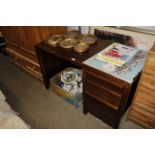 A modern single pedestal desk fitted three drawers