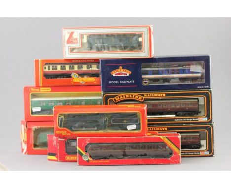 Nine boxed OO gauge coaches and carriages including Hornby x3 (R442, R430 & R435), Mainline 37-109 x2, Triang Hornby x2 (R622