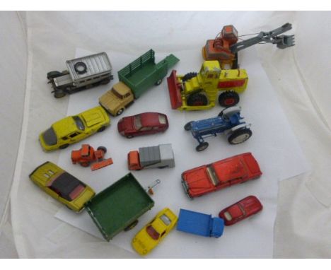 Group of vintage play worn die-cast vehicles including Corgi, Dinky and Lledo