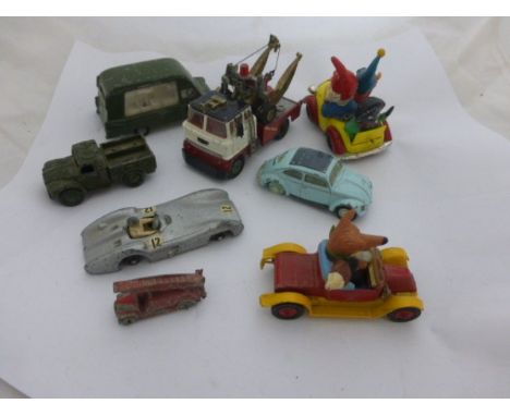 Eight vintage play worn die-cast vehicles including Corgi Comics Noddy's  Car with Golly to back and Basil Brush