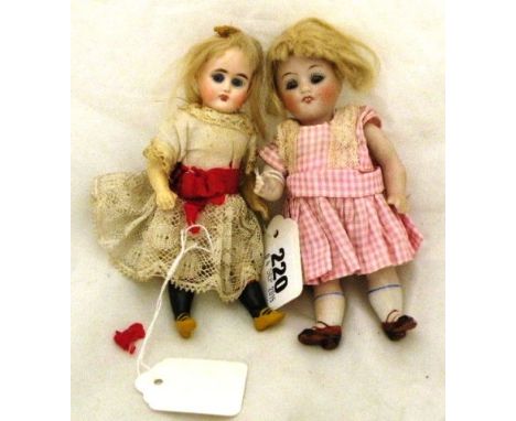 Two 5 1/2" bisque dolls No 1D clothes in good condition