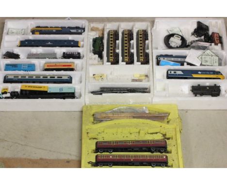 Group of OO gauge model railway items on box set inner packaging including Hornby Inter-City engines x2, Lima GWR 148 engine 